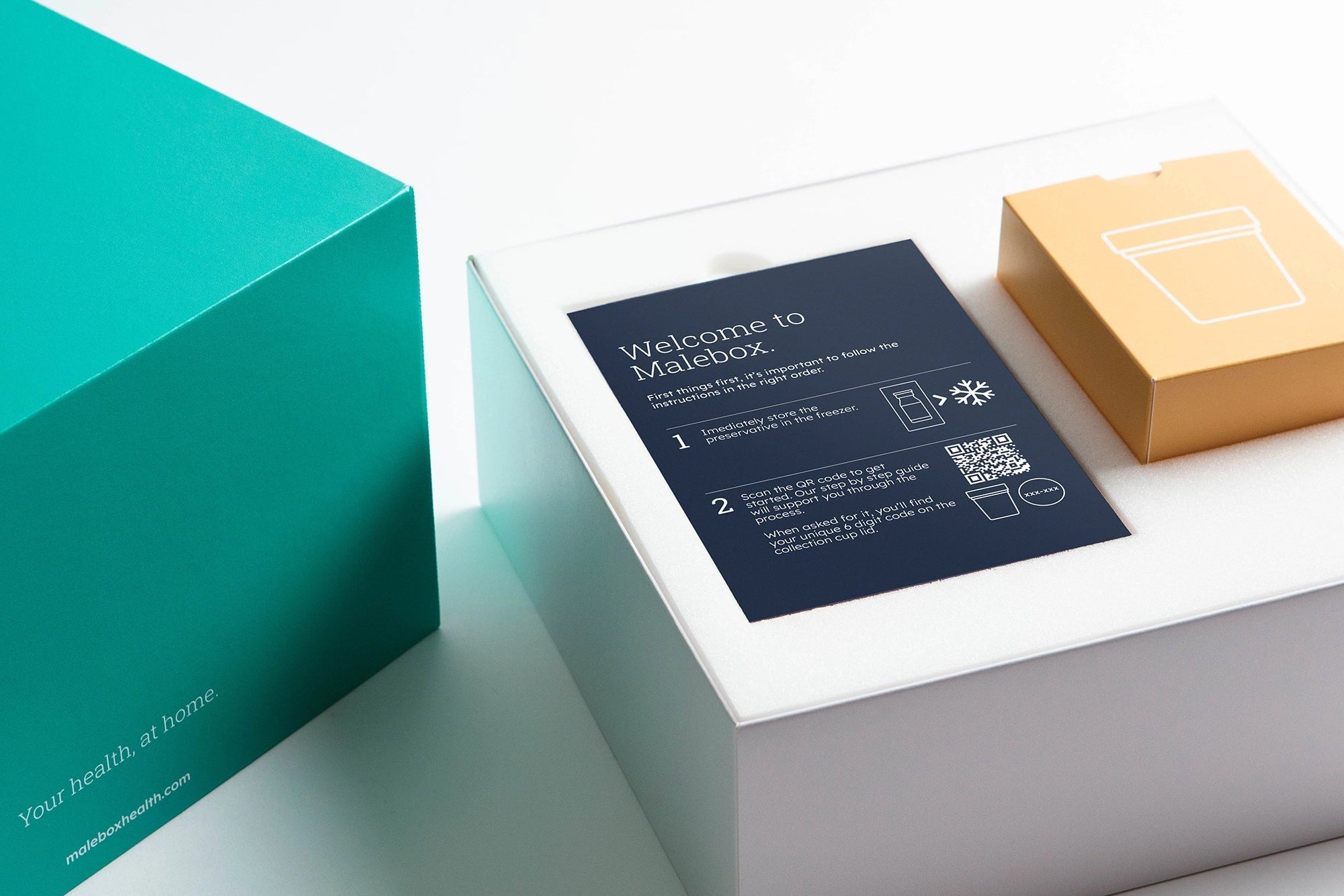 Teal box with a white lid featuring a product and a card on a light gray background